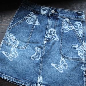 This is a blue jean skirt, with white butterflies all over. Sizing is 00